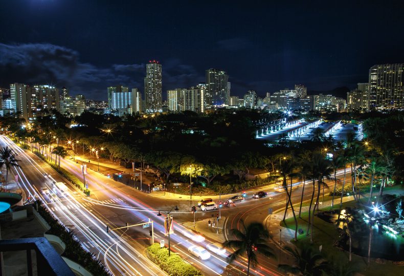 Look from above at highways crossing night city